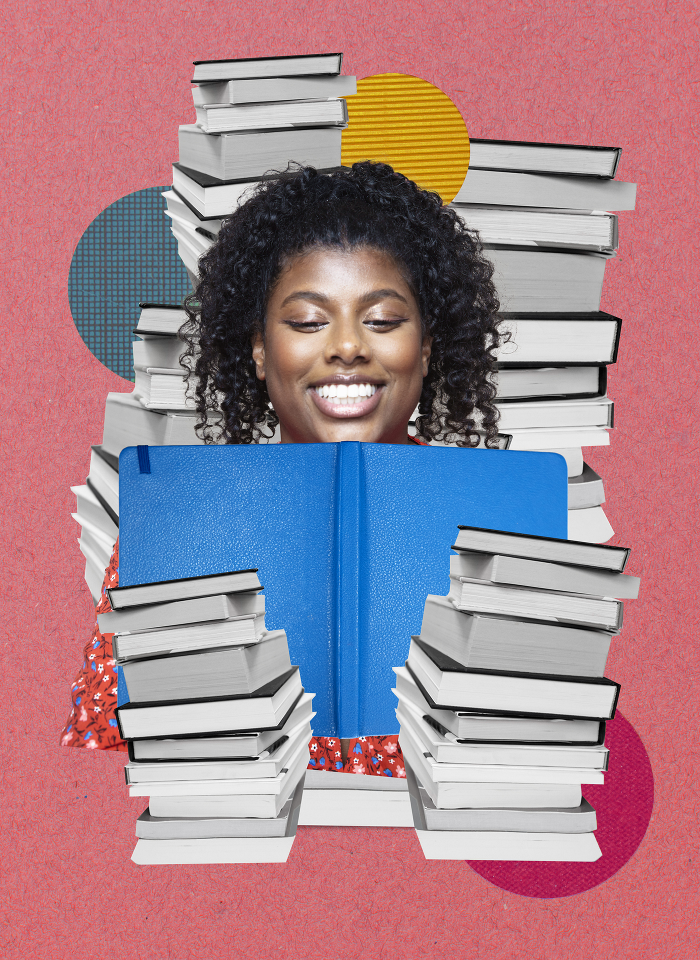 black woman smiling while reading a book in front of a stack of books
